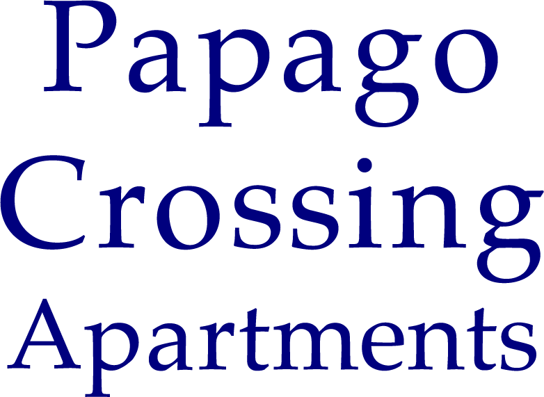 The image displays the words "Papago Crossing Apartments" in blue text on a green background.